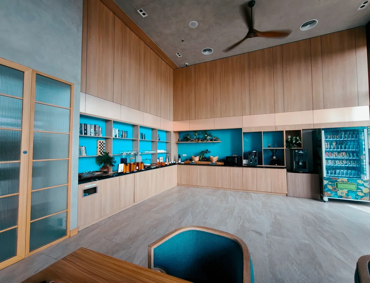 Office break room with booth seating and a shared table